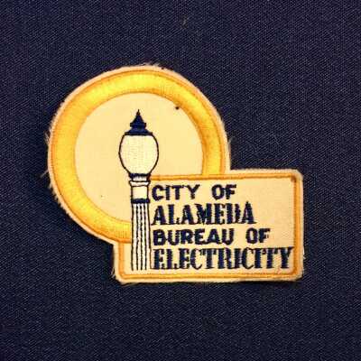 Bureau of Electricity Jacket Emblem badge, prior 2015