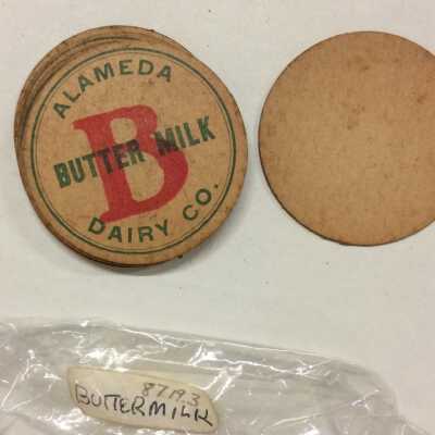 Cardboard buttermilk bottle caps from Alameda Dairy Co.