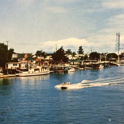 Postcard bosting, homes; estuary shoreline, east of Fruitvale Bridge, 1960s