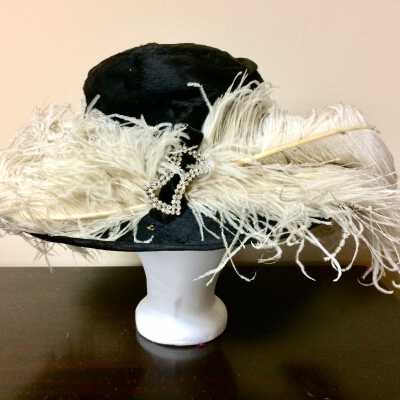 Black velvet wide brim hat with ostrich plumes and jeweled buckle, 1915