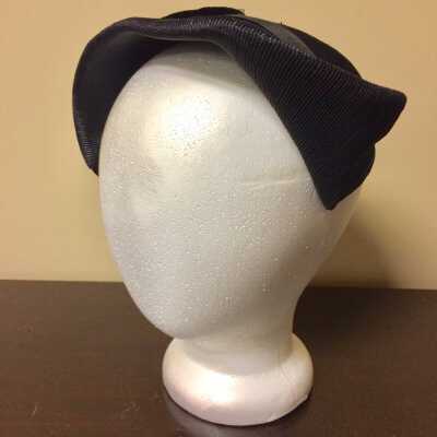 Brimless hat of black woven straw with bow, late 1930s or early 1940s