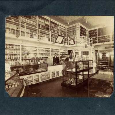 Photo of interior of a pharmacy, c. 1898