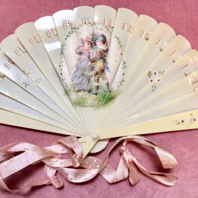 Celluloid fan with two children, early 1900s