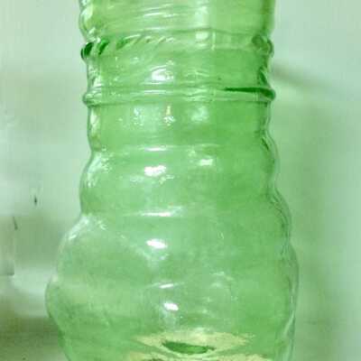 Pale green pressed glass triangular vases used in Frank's Barber Shop