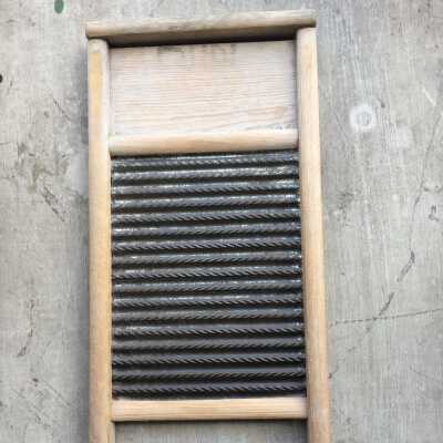 Dubl Handi Lutted tin scrub board in wood frame with legs from the Anderson family