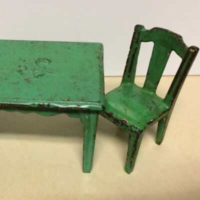 Iron dollhouse table and chair from the Meyers family, c. 1915-1920