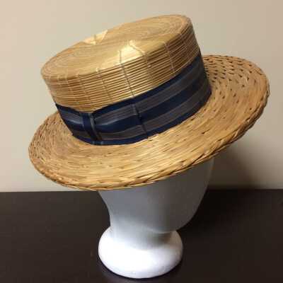 Boater style straw hat with navy blue striped silk band, c. 1915