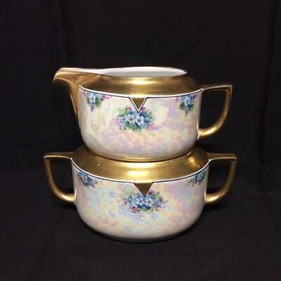 Cream and sugar set hand-painted with blue flowers by Jorgensen, c. 1930