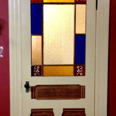 Interior Eastlake style door with colored lights, c. 1890
