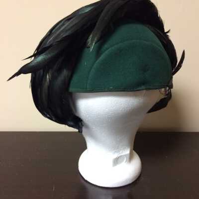 Suit hat of green felt with iridescent cock feathers, 1943