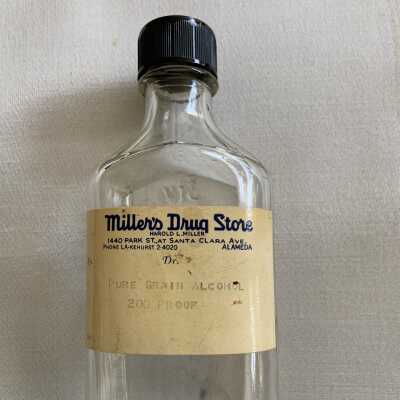 Clear glass medicine bottle from Miller's Drug Store, 1940-1950