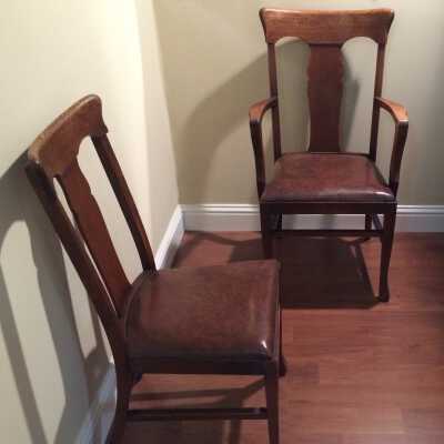 Six armless dining room chairs and armed master chair, c. 1900