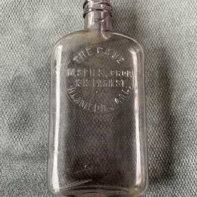 Whiskey flask of 'The Cave of 1313 Park Street', c. 1900-1910