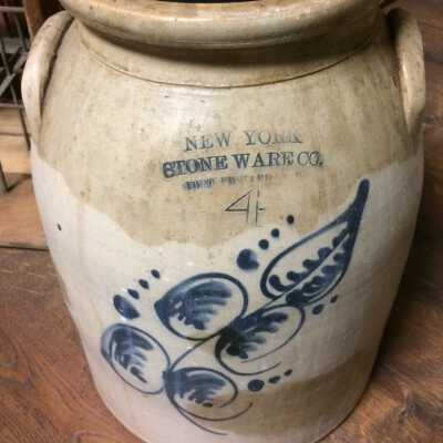 New York StoneWare Co. butter churn with blue flower design, before 1920