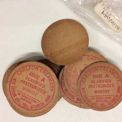 Cardboard bottle caps from the Carlton Creamery, before 1923
