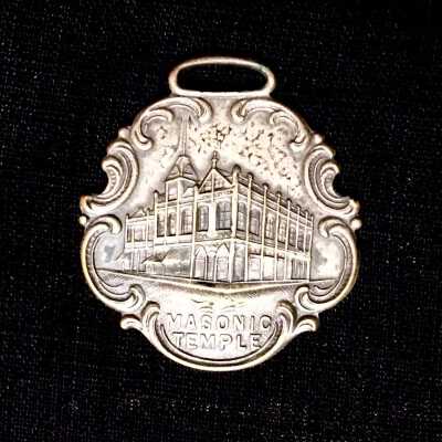 Watch fob depicting the Masonic Temple, of William Cox, 1909
