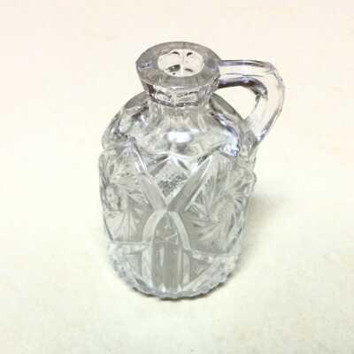 Clear pressed glass vinegar cruet in a pseudo pinwheel pattern, early 1900s