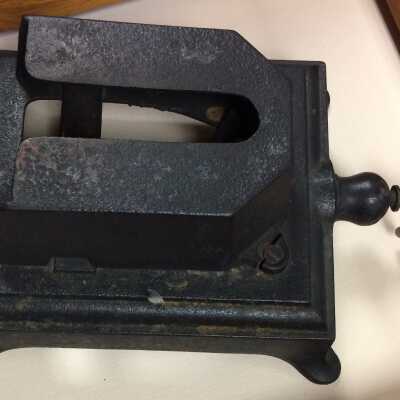 Sad iron and stand from Alameda Cleaning & Dyeing Works, c. 1904