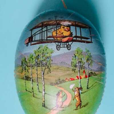 Cardboard easter egg with chicks flying biplanes, c. 1912