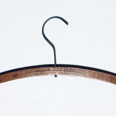 Wooden hanger from Yokohama Suit Cleaners, c. 1920s