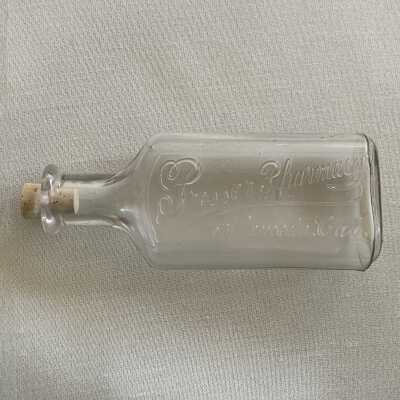 Advertising medicine bottle with stopper from Prosser Pharmacy, c. early 1900s