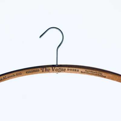 Wooden advertising hanger from The Vogue Cleaners and Dyers, prior 1970