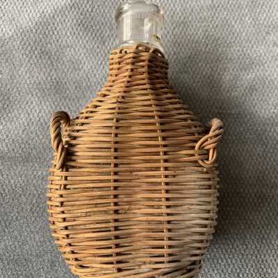 Clear glass liquor bottle from the basement of 2008 Clinton Ave