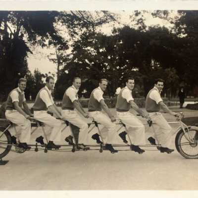 Photo postcard of riders of the Amaral six-seat bicycle, at Lincoln Park, 1931