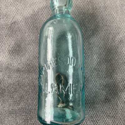 Double seamed aquamarine Empire Soda Works bottle, c. 1890s