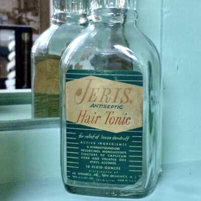Glass bottle of Jeris Hair Tonic, c. 1980s