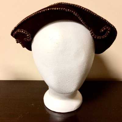 Brown velour hat with turned-up brim with rust colored glass bead trim, c. 1950s