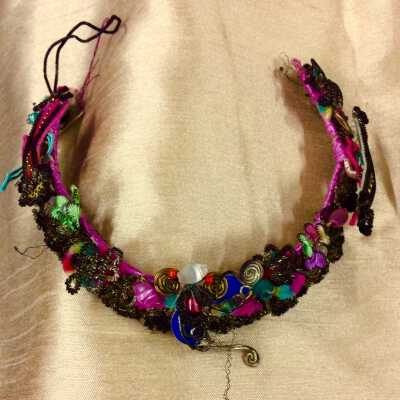 Headband of silk covered beads and flowers with chinese head ornament, c. 1920