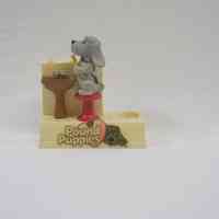 2004.68.1b Pound Puppies Batter Toothbrush Stand Untagged Front.jpg