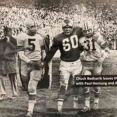 Chuck Bednarik leaving field after 1960 Eagles Championship (repro)