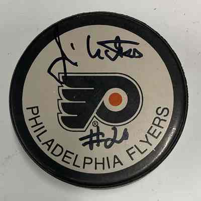 Jimmy Watson signed hockey puck