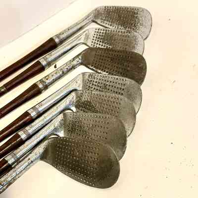 Antique golf clubs - seven different irons