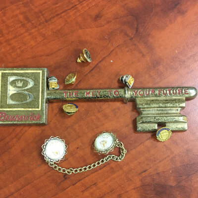 Brunswick Bowling Company salesmen’s pins, key