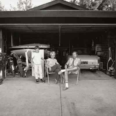 Our house is built with the living room in the back, so in the evenings we sit out front of the garage and watch the traffic go by