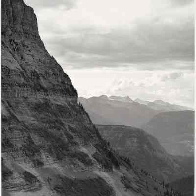 General view of Rocky Mountains west of Continental Divide seen from top of Logan Pass on Going-to-the-Sun highway. Glacier National Park, Montana