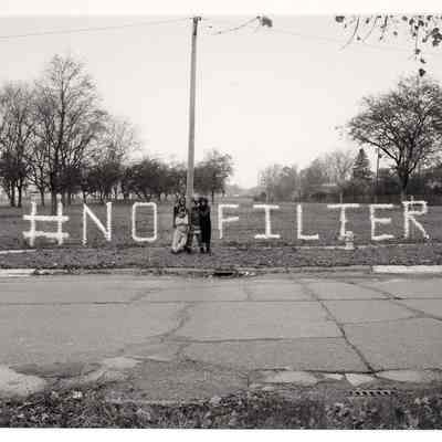 A Message in Nestle Water Bottles from Shea Cobb, Amber Hasan, Macana Roxie and LaToya Ruby Frazier at Sussex Drive and West Pierson Road, Flint, MI