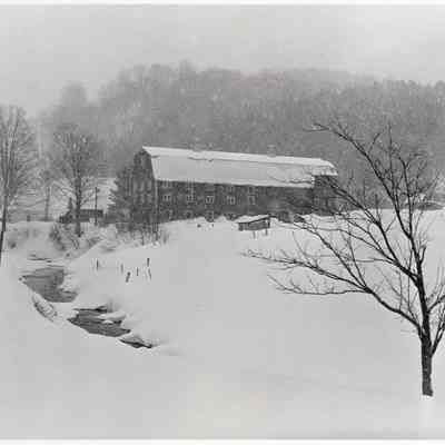 Dairy barn and farm during snowstorm near Barnard, Windsor County, Vermont