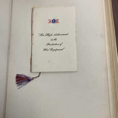 Excerpt from the Simmons Army-Navy Production Award Scrapbook: Shows the permanently glued copy of the program.
