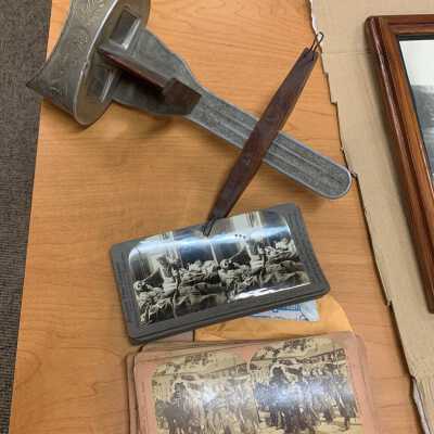 Stereoscope and Slide Examples: JPG photo.  Users placed the slides in the wooden holder and slid it along the length of its slide until they achieved a lifelike 3D stereo image.  Personal collection of Wayne Gendron.