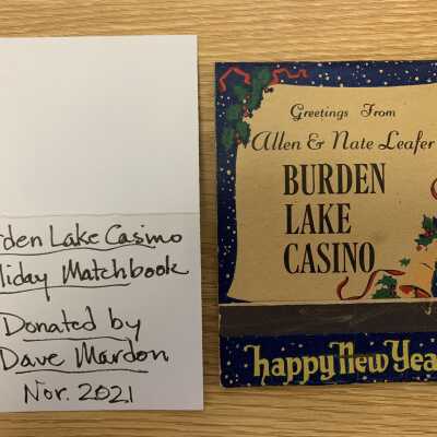 Allen & Nate Leafer's Burden Lake Casino Holiday Matchbook: Closed front view with notation of its donation by Dave Mardon in November of 2021.