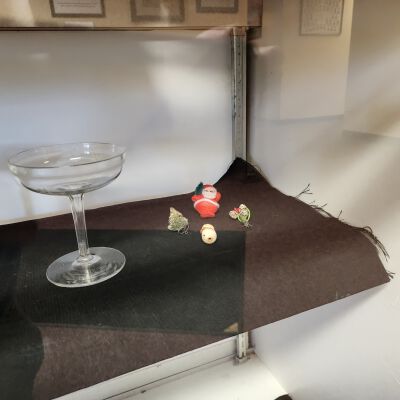 Display case of Averill Family-Owned Items - Close up 3: Champagne glass and Christmas items.
