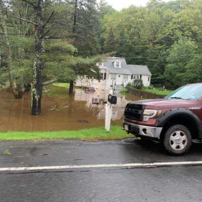Route 66 just North of Town Hall: One of many homes and businesses located in low lying areas that suddenly became islands.  A more than two foot sudden surge in local lake levels caused similar flooding of homes located on and near the lakes.