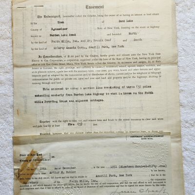 Doc # 1 Easement 1951-12-10 (YYYY-MM-DD) FPO (First Page Only): FM to NYSEG, Joseph J. Moloney for NYSEG and Arthur M. Butler for FM. Easement in consideration for $1 to allow installation of three poles and a power line from Burden Lake Road to FM and adjacent cottages. Also includes correspondence and a receipt for payment of $1 from NYSEG to FM.
