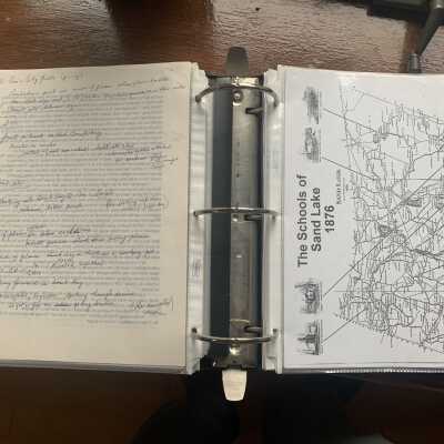 Left Ron Berti B17 Bomber notes and Right Schools of Sand Lake Map