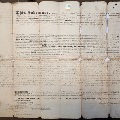 Doc # 136 Court of Chancery Indenture 1834-02-15 P1-of-3: Full unusually large document face.  David L. Seymour, Master in Chancery, to Daniel Wright of Troy at the time. Entitled as a "Master's Deed" as authorized by a Court of Chancery that transfers property someplace in Troy to Wright as a result of a court-authorized public auction conducted by Seymour as the Court-appointed Master for some unspecified reason.  Unfortunately, the document is in extremely fragile condition and difficult to read.