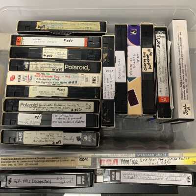 Photo of the Plastic Box in which the VHS Recordings are Stored: The box is further stored in Drawer 4 of SLHS File Cabinet 1.  Most of these recordings have copied to DVD per the DVD list.
